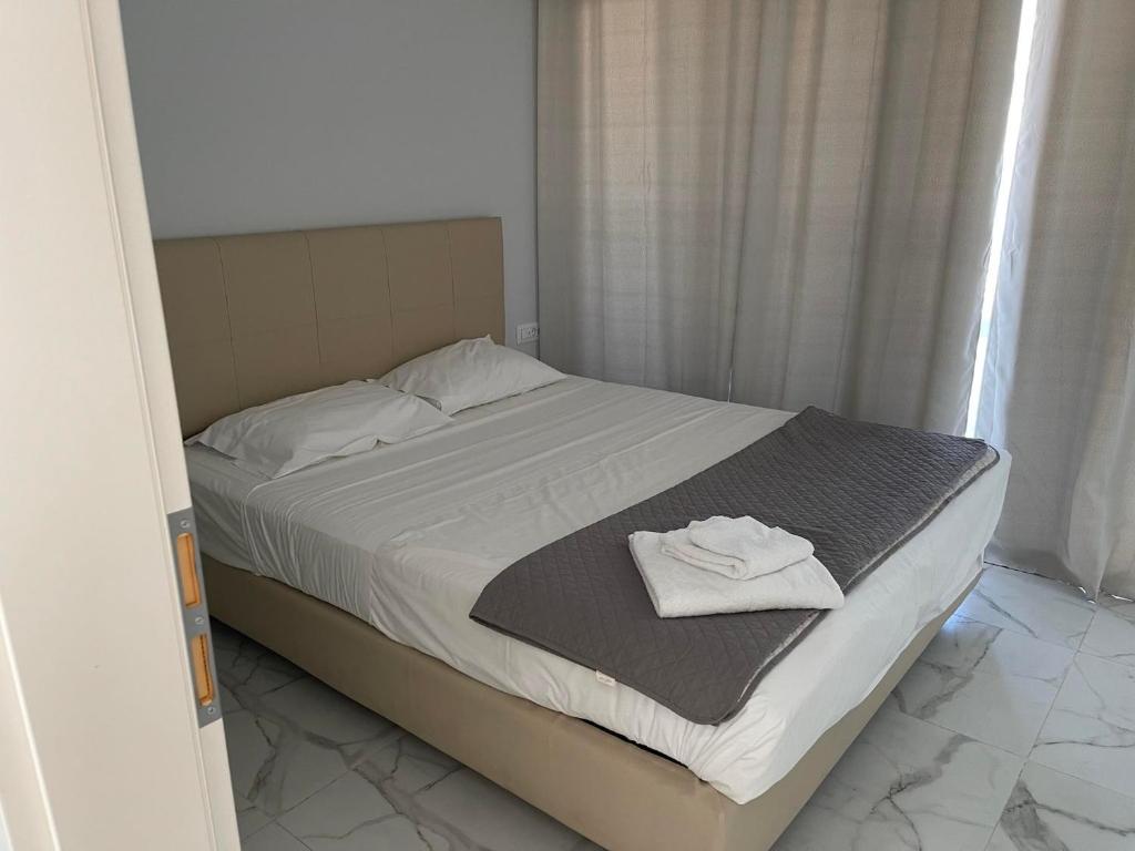 Postel nebo postele na pokoji v ubytování Pals Studios Pefkos
