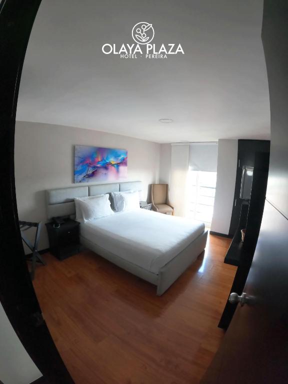 Postel nebo postele na pokoji v ubytování Hotel Olaya Plaza