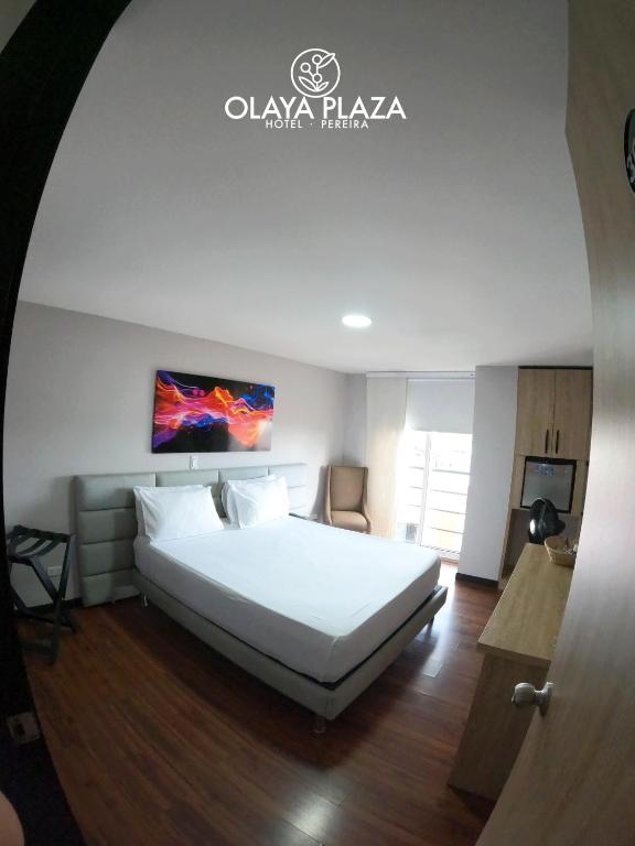 Postel nebo postele na pokoji v ubytování Hotel Olaya Plaza
