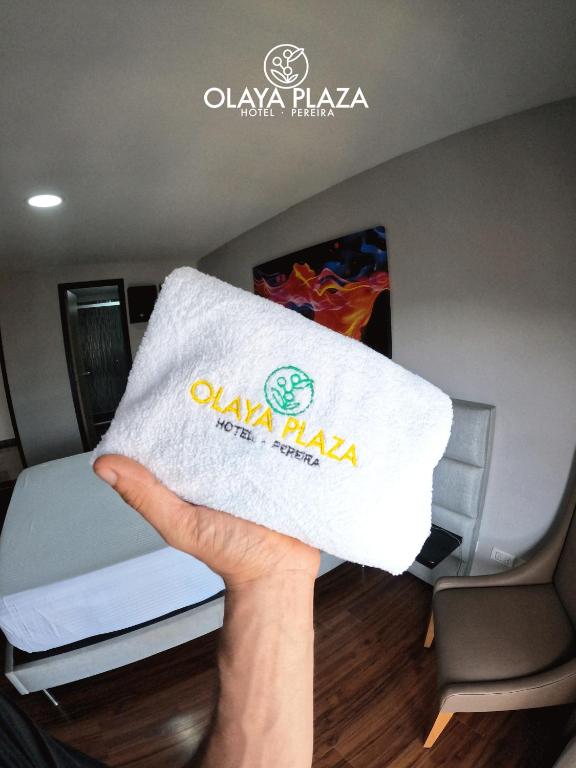 Postel nebo postele na pokoji v ubytování Hotel Olaya Plaza