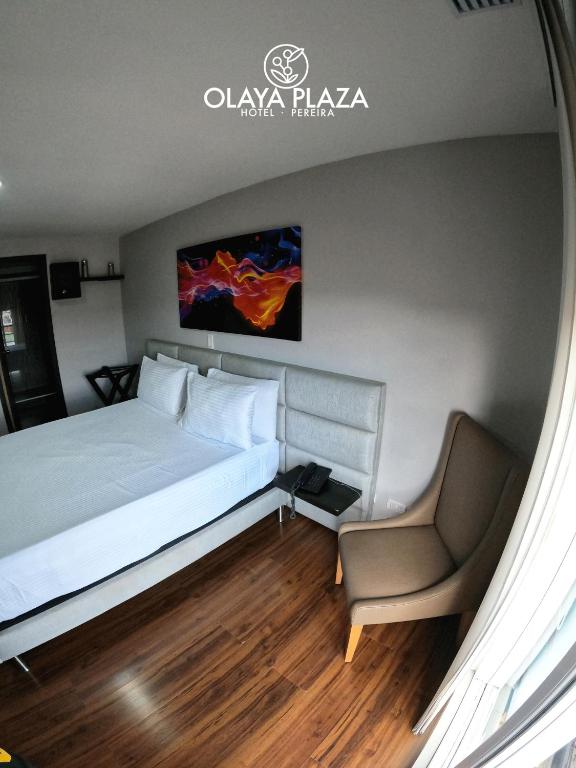 Postel nebo postele na pokoji v ubytování Hotel Olaya Plaza