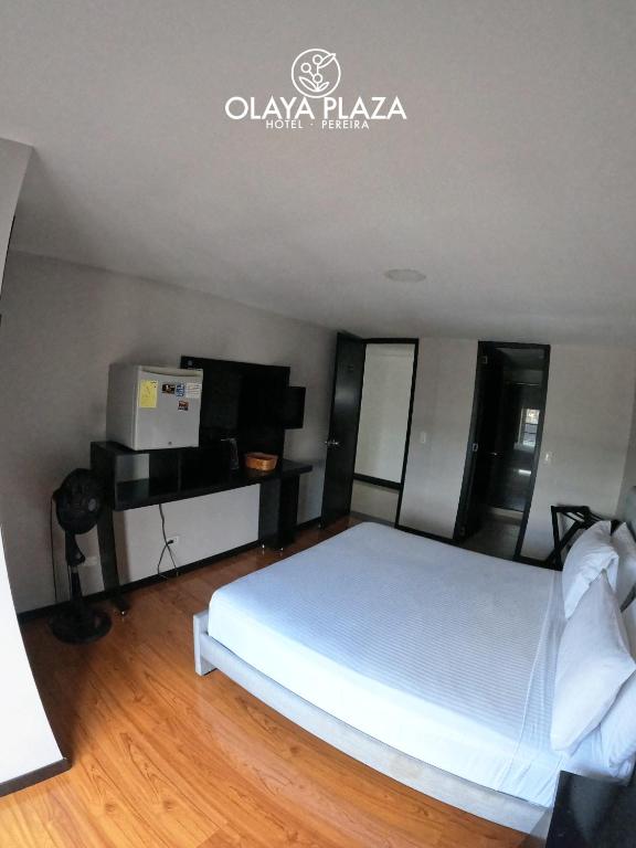 Postel nebo postele na pokoji v ubytování Hotel Olaya Plaza