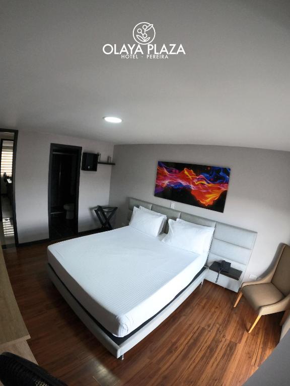 Postel nebo postele na pokoji v ubytování Hotel Olaya Plaza