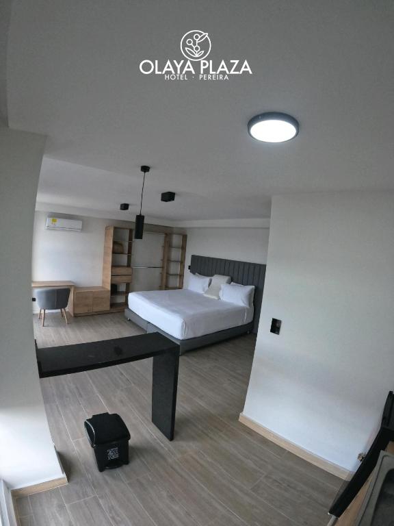 Postel nebo postele na pokoji v ubytování Hotel Olaya Plaza