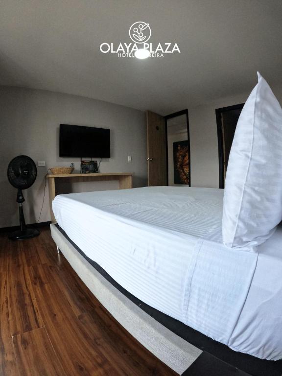 Postel nebo postele na pokoji v ubytování Hotel Olaya Plaza