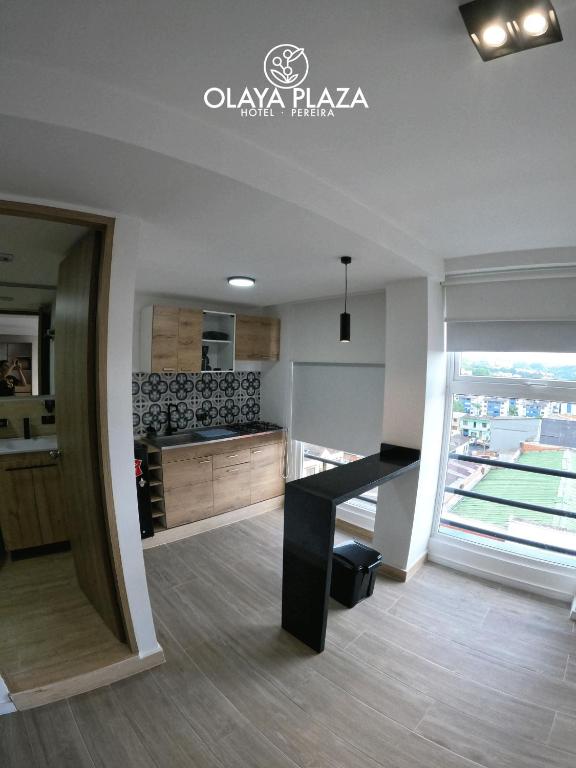 Kuchyň nebo kuchyňský kout v ubytování Hotel Olaya Plaza