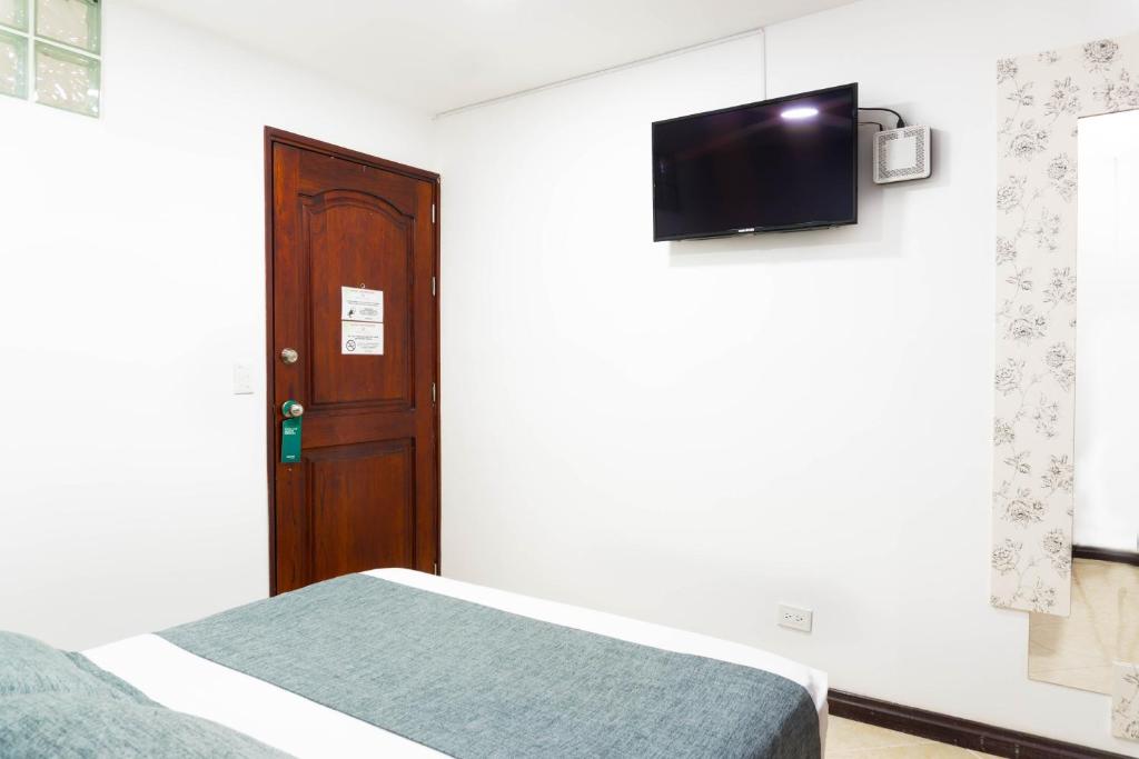 TV a/nebo společenská místnost v ubytování Hotel Palo Alto Laureles