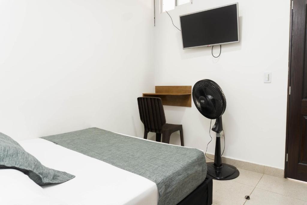 TV a/nebo společenská místnost v ubytování Hotel Palo Alto Laureles