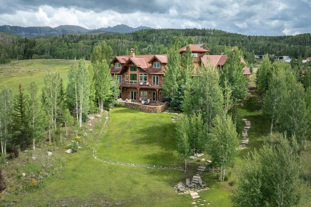 an aerial view of a large house in the woods at Camp Telluride - golf course, views, hot tub, gym! in Telluride