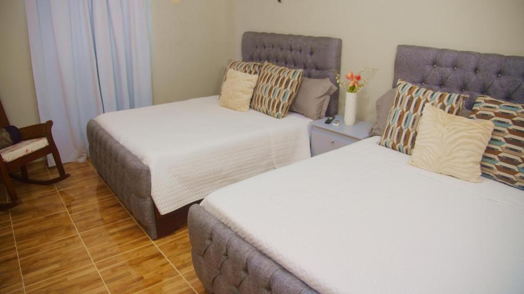 Postel nebo postele na pokoji v ubytování Hotel Vista al Morro