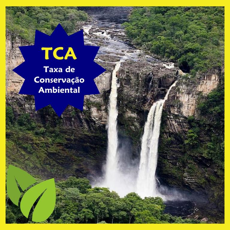 a waterfall in the jungle with the text taa tax be conservativeciplinary at Chales Estrela Veadeiros in Alto Paraíso de Goiás