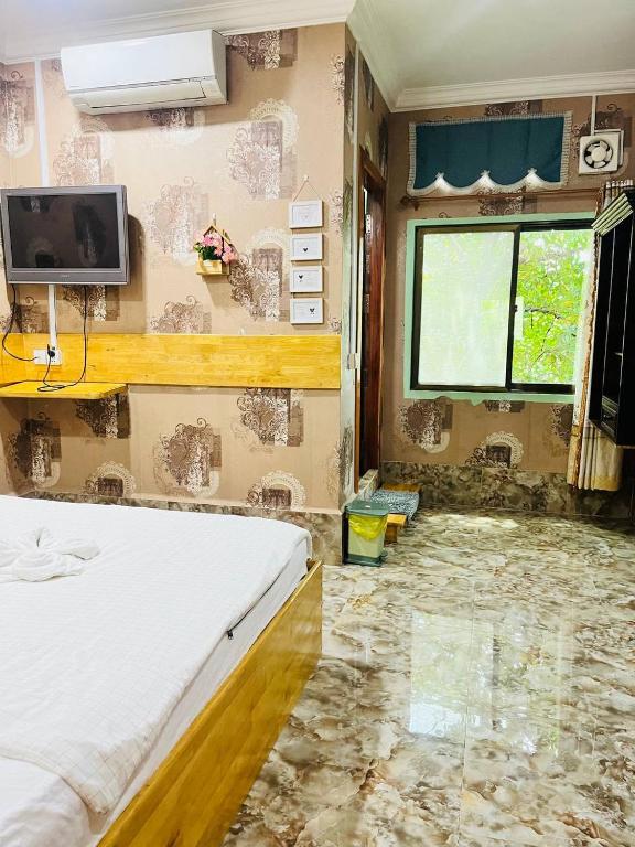 Postel nebo postele na pokoji v ubytování Por Chey Guesthouse
