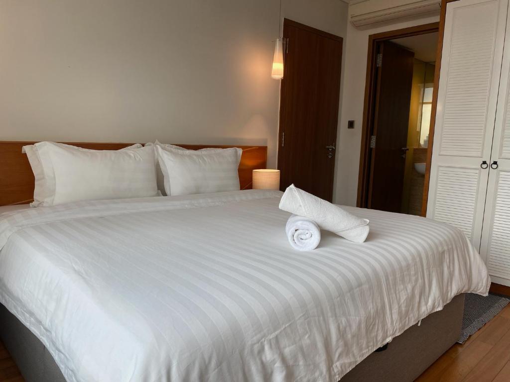 Postel nebo postele na pokoji v ubytování Stella Maison KLCC