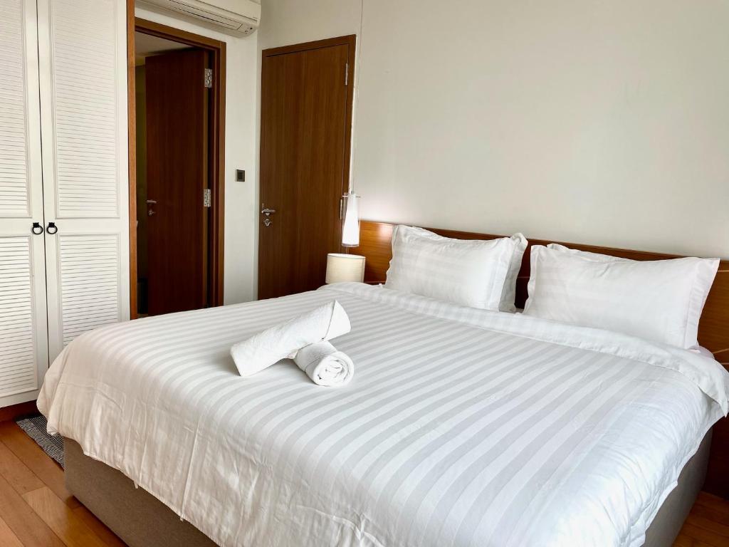 Postel nebo postele na pokoji v ubytování Stella Maison KLCC