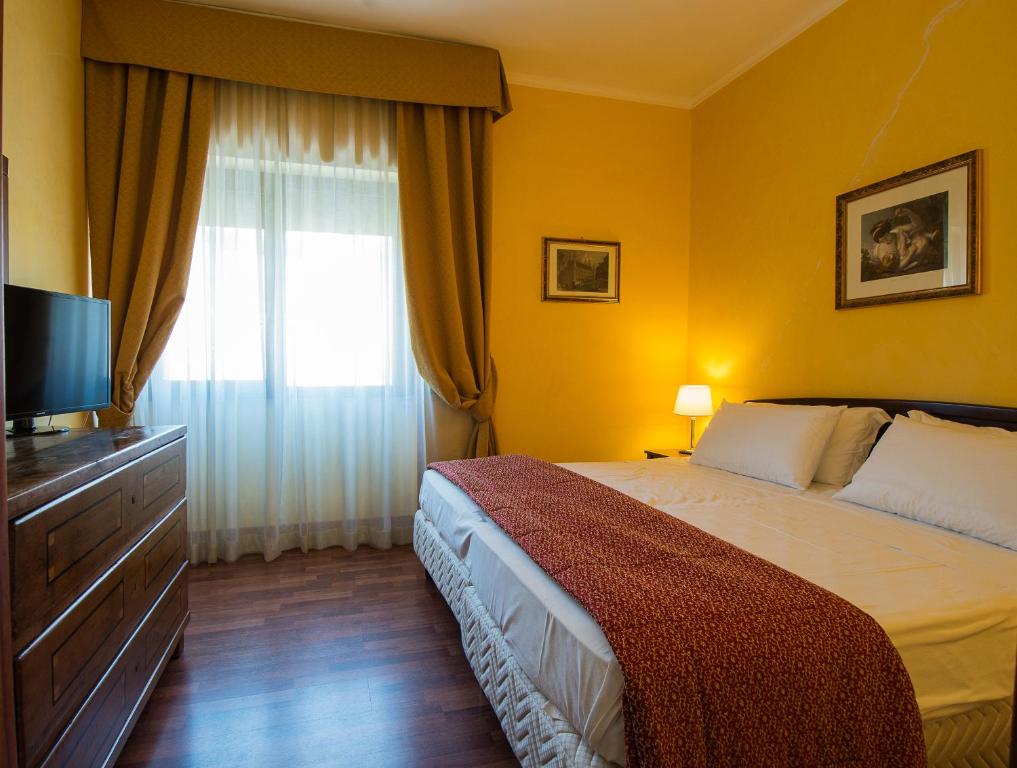 Postel nebo postele na pokoji v ubytování Hotel Della Valle
