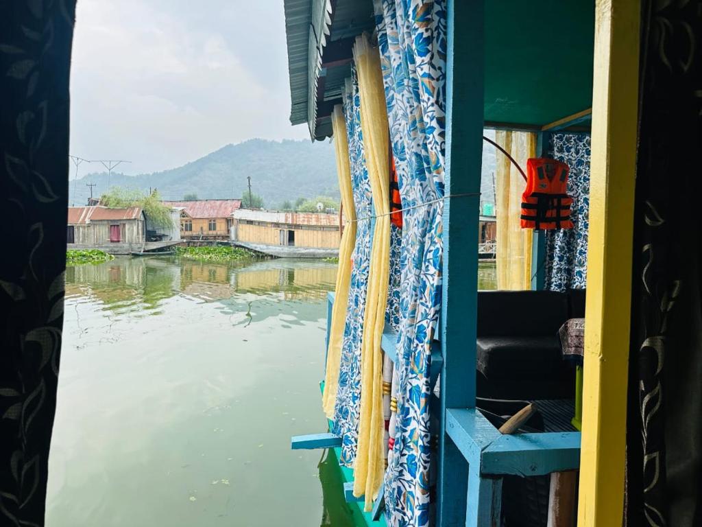 a view out a window of a boat on a river at H.B Rocket paradise in Srinagar