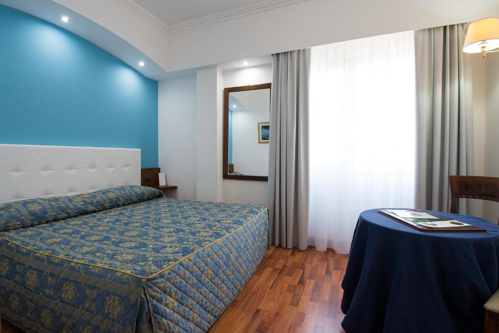 Postel nebo postele na pokoji v ubytování Hotel Della Valle
