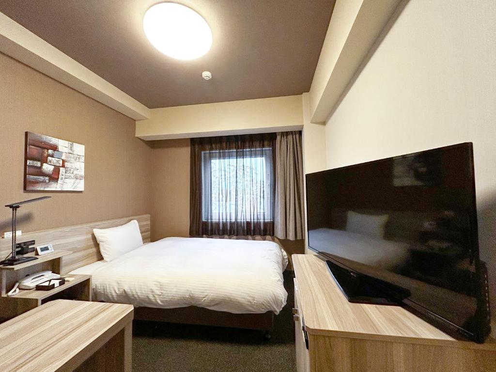 TV a/nebo společenská místnost v ubytování Hotel Route-Inn Shinshiro