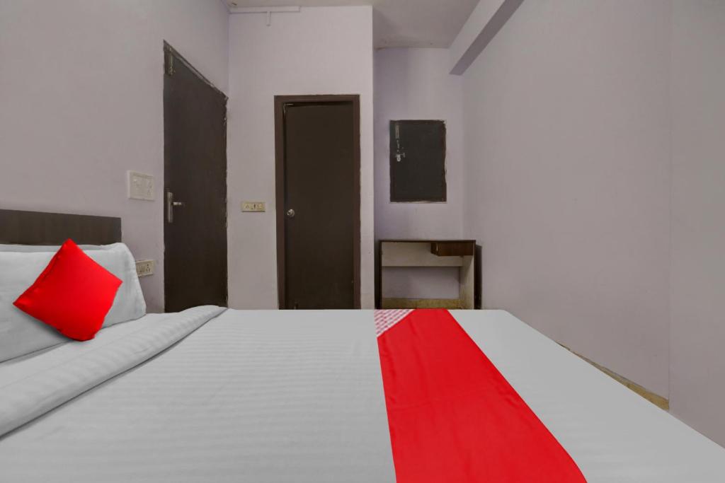 Postel nebo postele na pokoji v ubytování Hotel O Doraemon Residency
