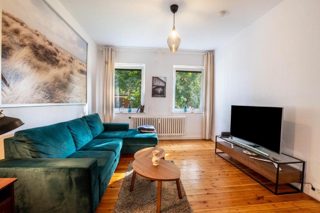 TV a/nebo společenská místnost v ubytování Ferienwohnung am Ostufer
