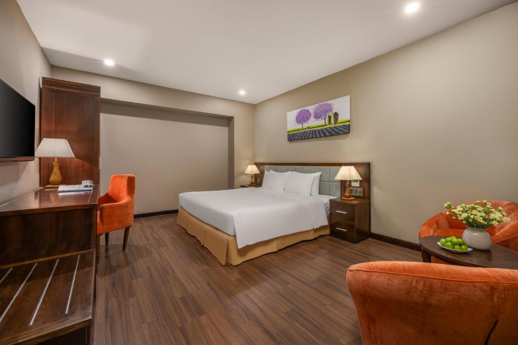 Postel nebo postele na pokoji v ubytování Yarra Ocean Suites Danang