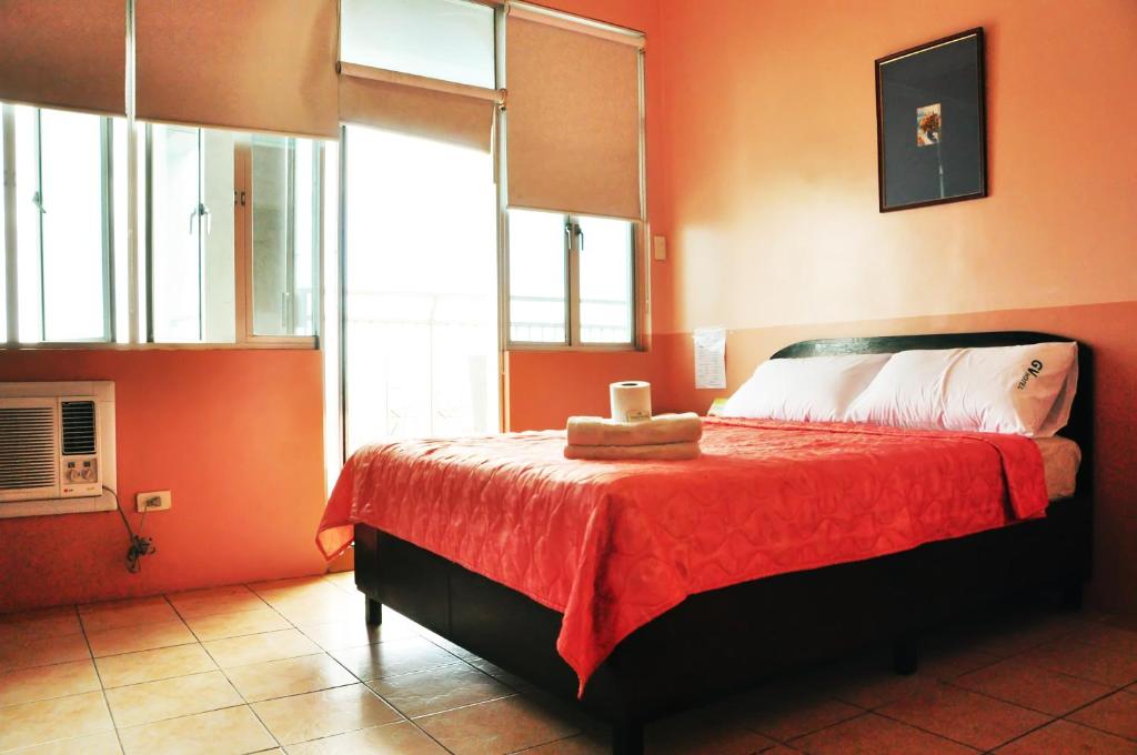 Postel nebo postele na pokoji v ubytování GV Tower Hotel