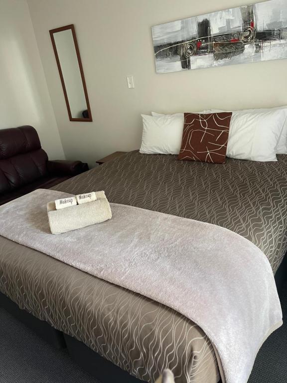 Postel nebo postele na pokoji v ubytování Amalfi Motor Lodge
