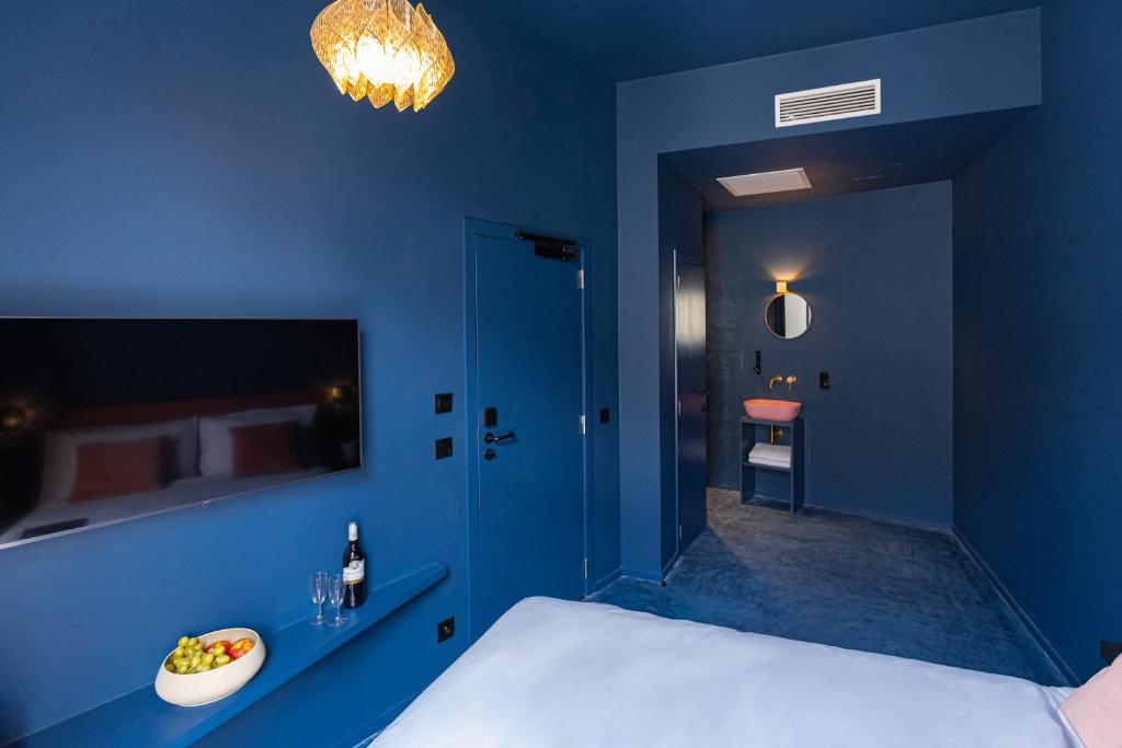 Postel nebo postele na pokoji v ubytování The Mila Hotel