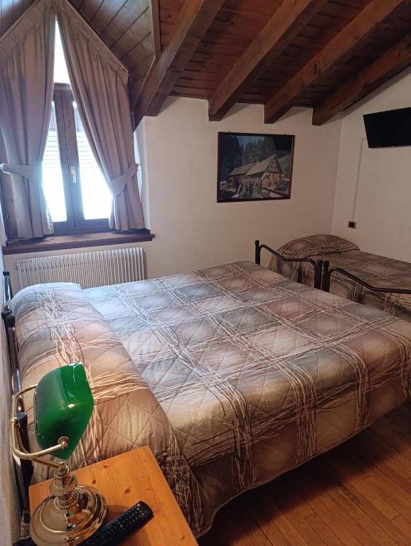 Postel nebo postele na pokoji v ubytování Garnì Bonsai