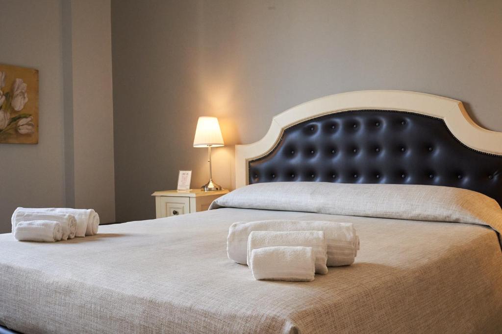 Posteľ alebo postele v izbe v ubytovaní La Collegiata Guest House