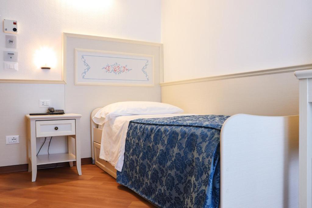 Postel nebo postele na pokoji v ubytování Hotel Principe