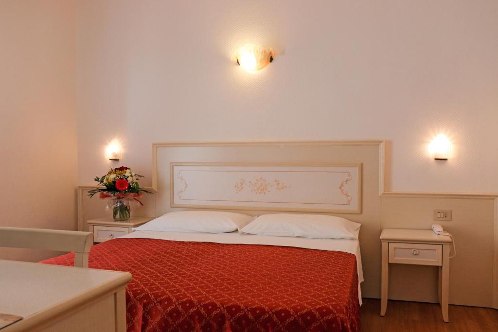 Postel nebo postele na pokoji v ubytování Hotel Principe