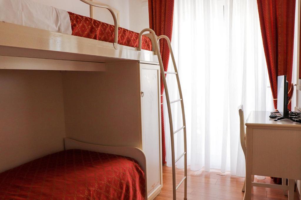 Postel nebo postele na pokoji v ubytování Hotel Principe