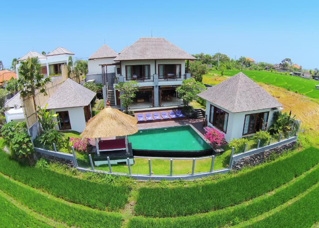 an aerial view of a house with a swimming pool at Jabunami Villa in Canggu