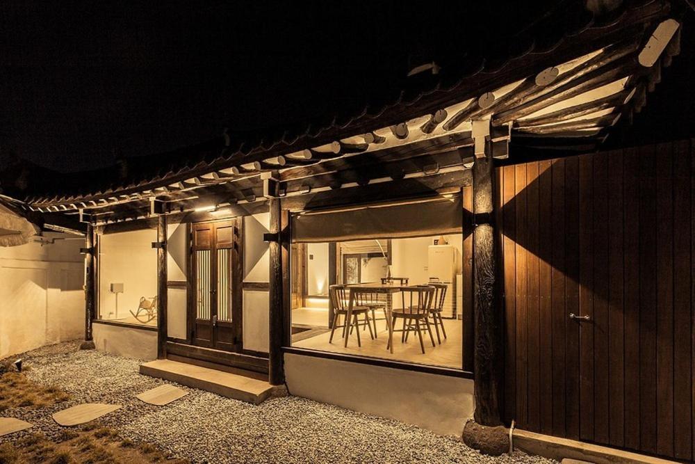 a house with a table and chairs on the patio at Jeonju Leisure in Jeonju
