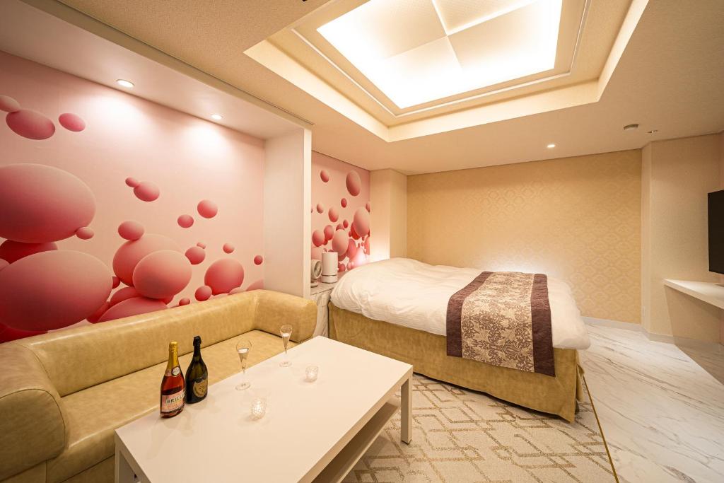 Postel nebo postele na pokoji v ubytování HOTEL X