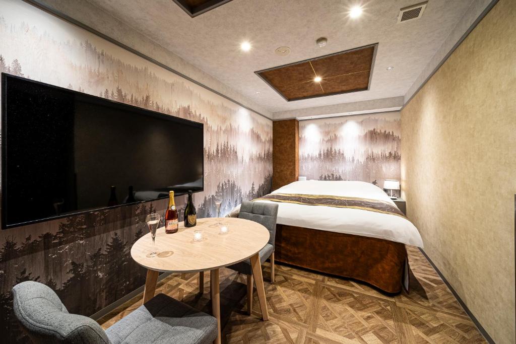 Postel nebo postele na pokoji v ubytování HOTEL X