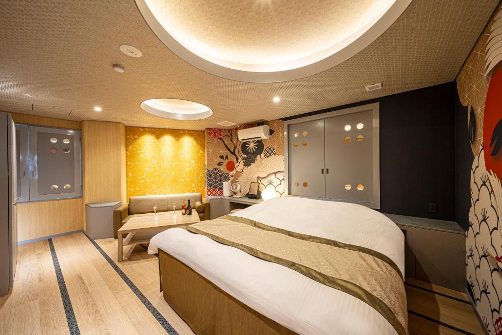 Postel nebo postele na pokoji v ubytování HOTEL X