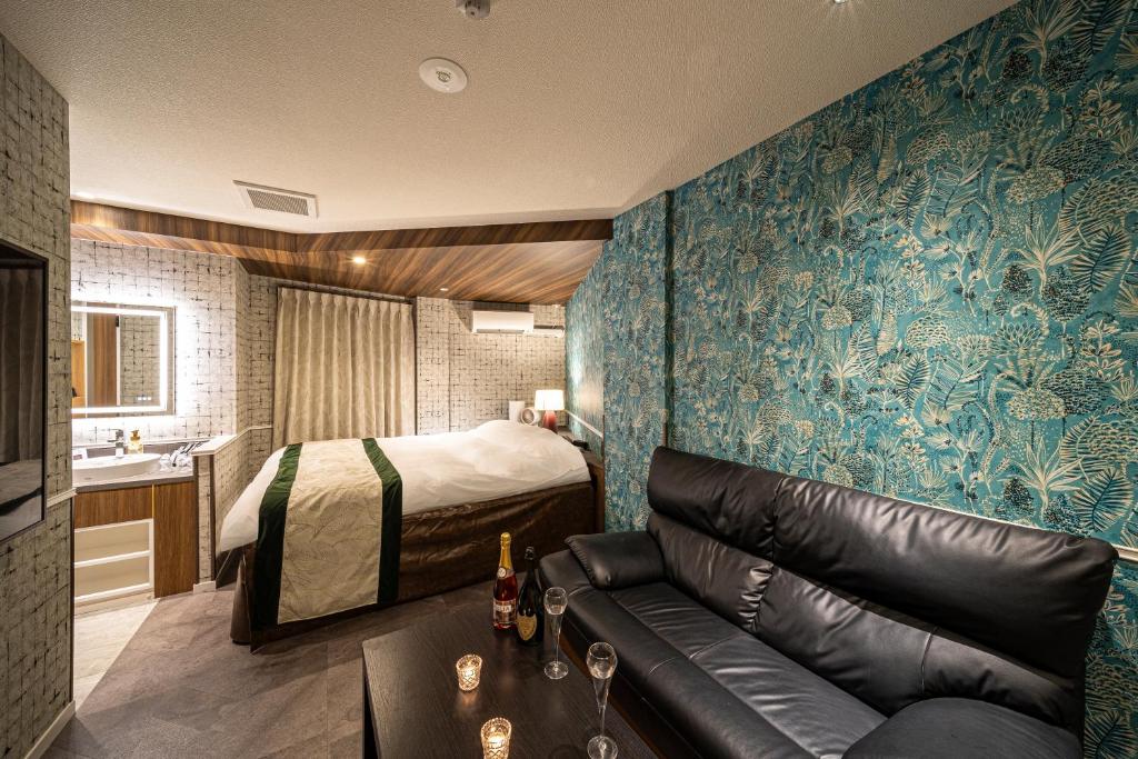 Postel nebo postele na pokoji v ubytování HOTEL X