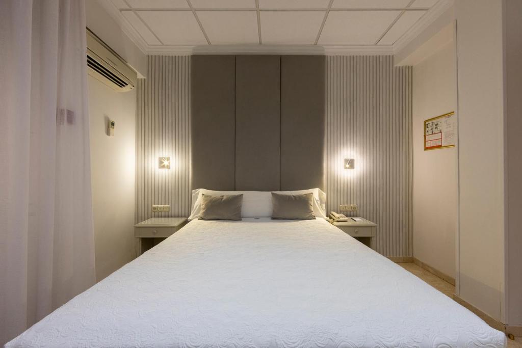 Postel nebo postele na pokoji v ubytování Hotel Sacromonte