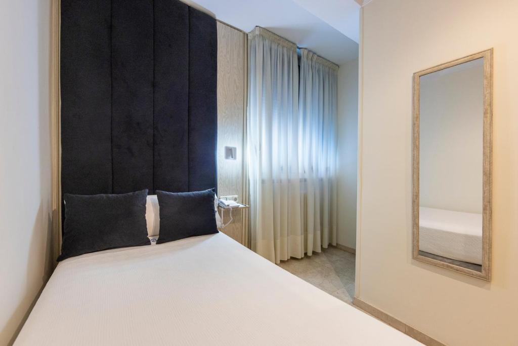 Postel nebo postele na pokoji v ubytování Hotel Sacromonte