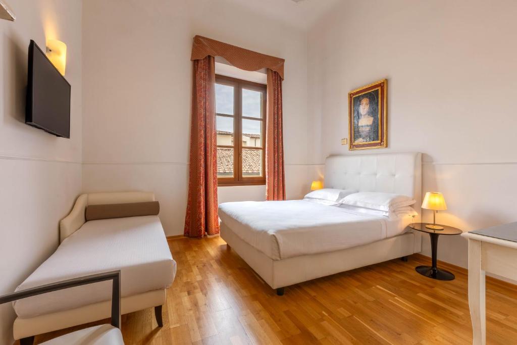 Postel nebo postele na pokoji v ubytování Relais Hotel Centrale "Dimora Storica"