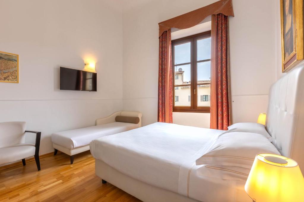 Postel nebo postele na pokoji v ubytování Relais Hotel Centrale "Dimora Storica"