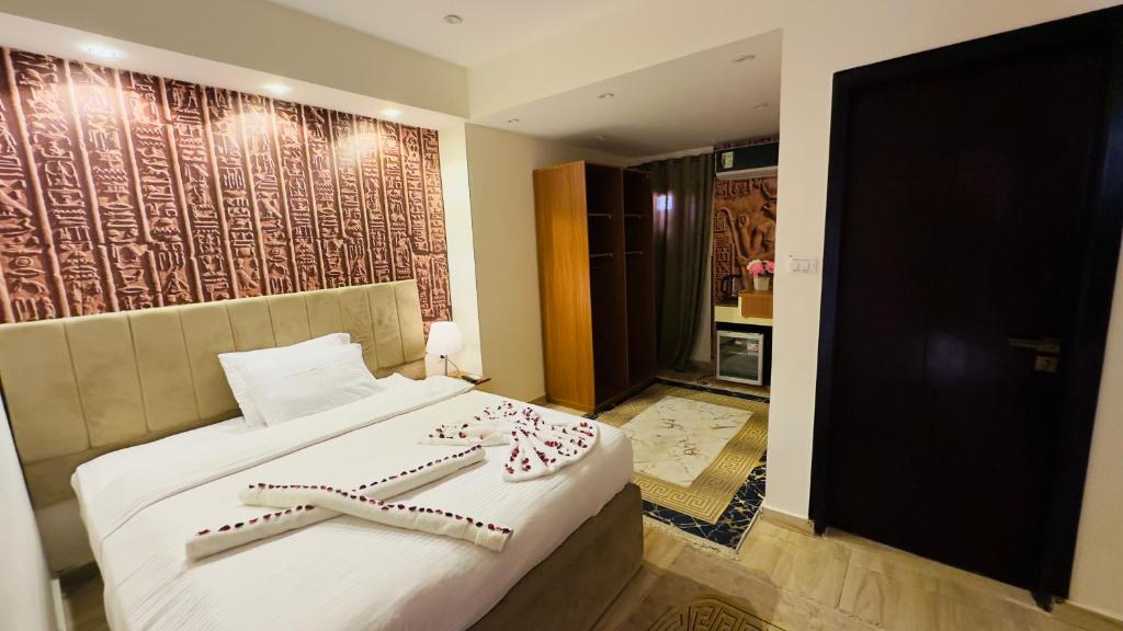 Voodi või voodid majutusasutuse Locanda pyramids view toas