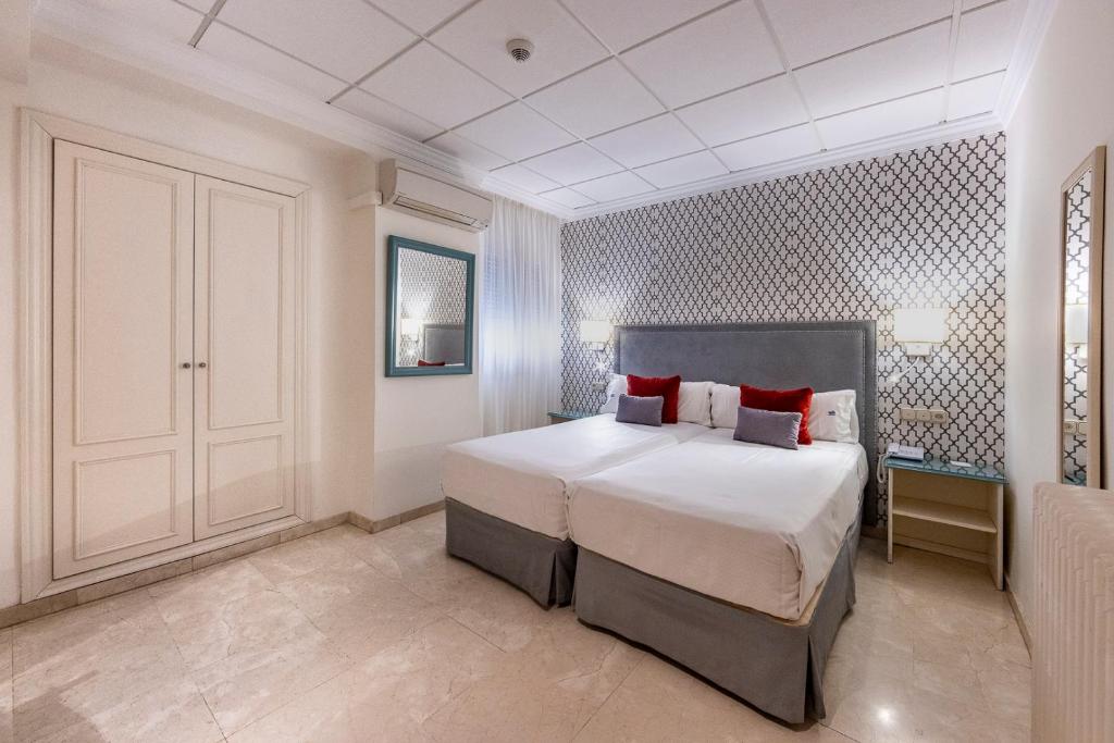 Postel nebo postele na pokoji v ubytování Hotel Sacromonte