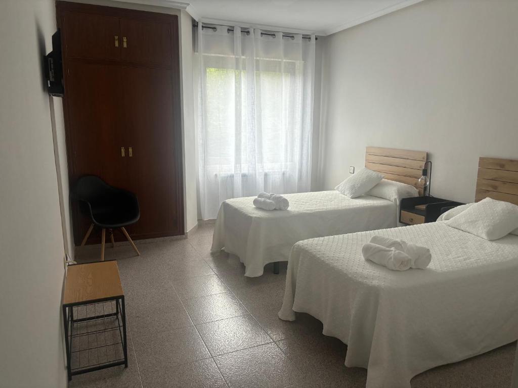 Postel nebo postele na pokoji v ubytování Hotel Juan Manuel