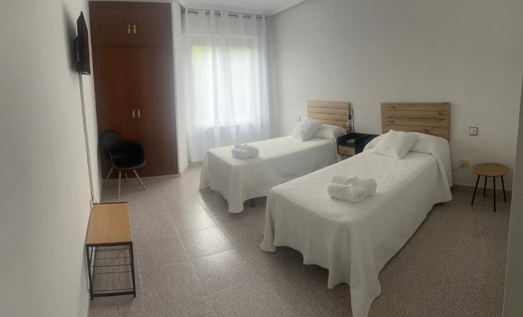 Postel nebo postele na pokoji v ubytování Hotel Juan Manuel