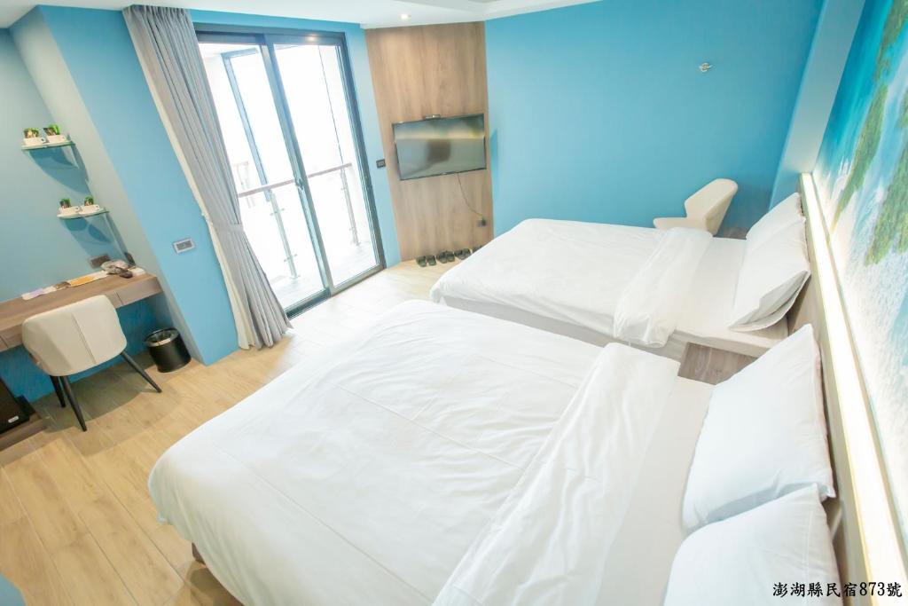 Postel nebo postele na pokoji v ubytování Tropical house Homestay