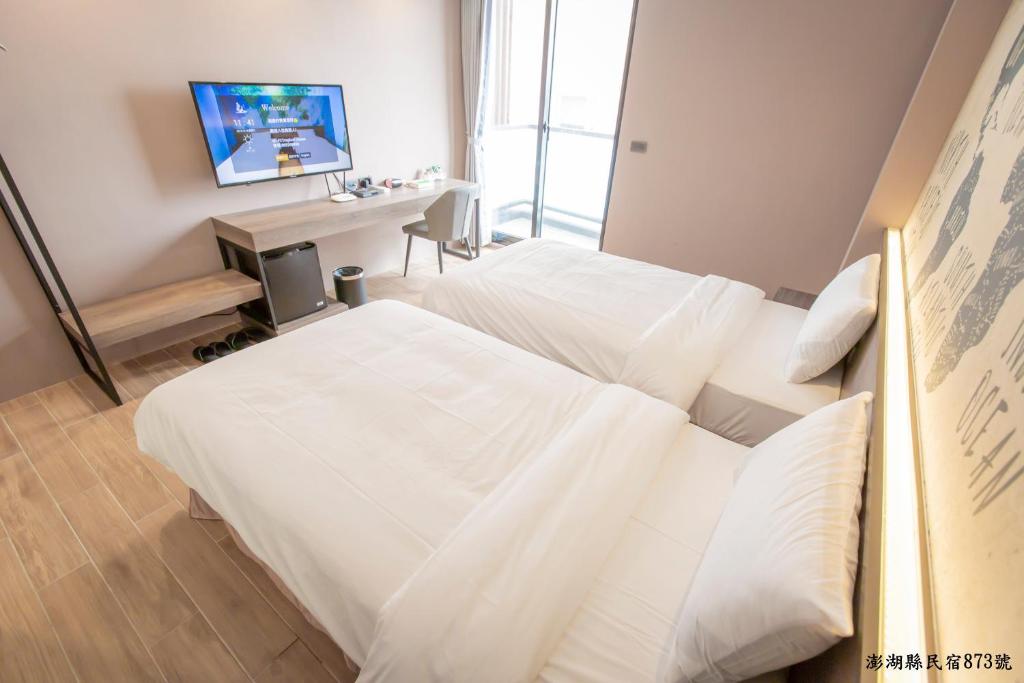 Postel nebo postele na pokoji v ubytování Tropical house Homestay