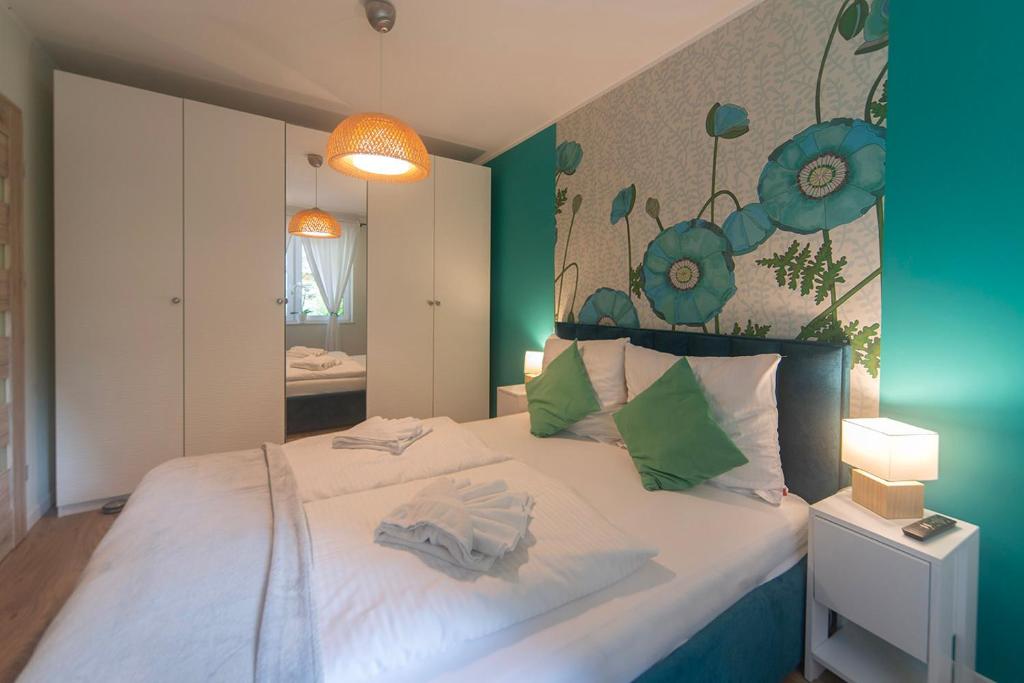Posteľ alebo postele v izbe v ubytovaní Trevilles Apartamenty Pogodny